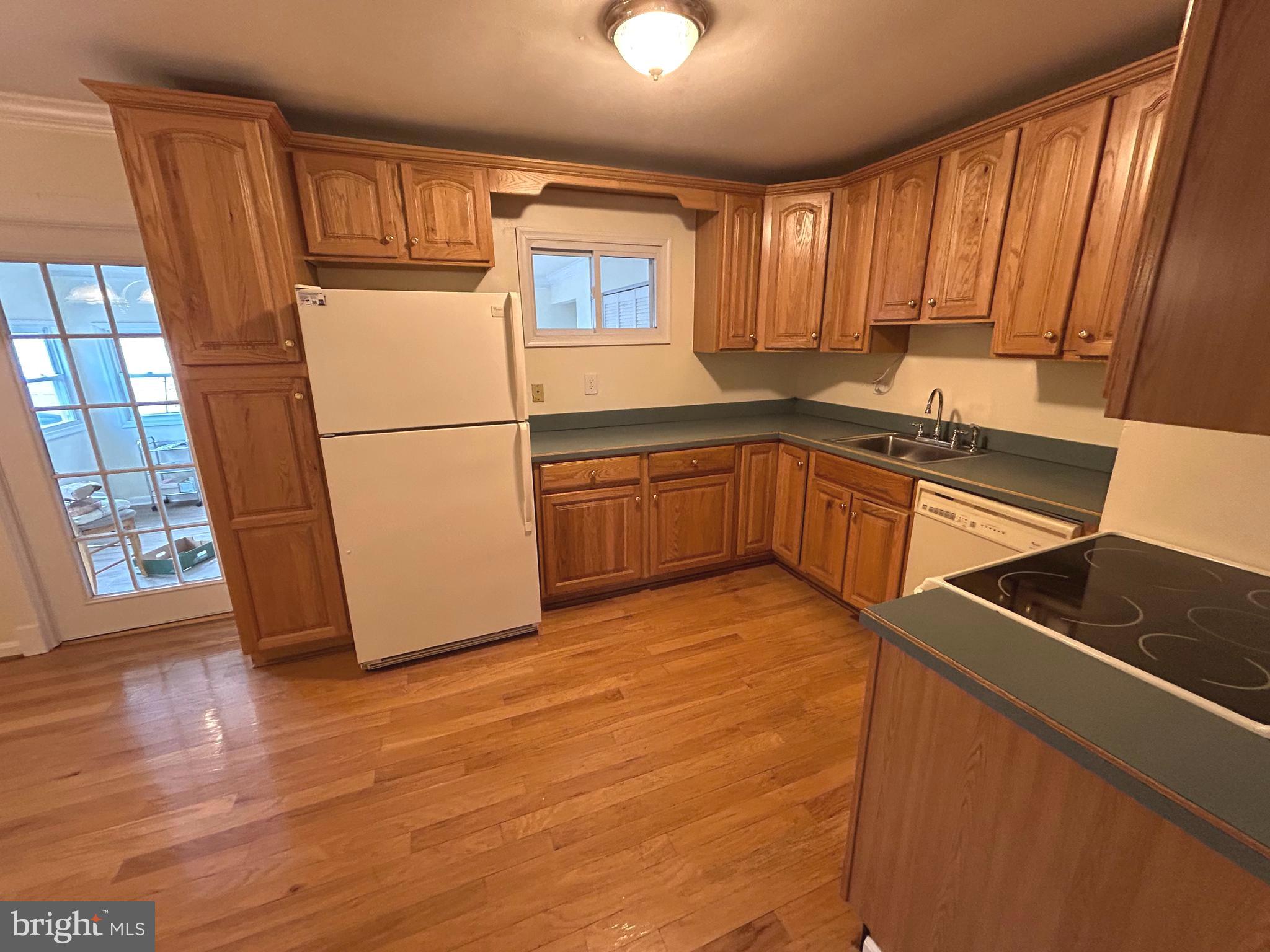 111 North Hickory Road Sterling, VA 20164 - Photo 18 of 30 a kitchen with stainless steel appliances granite countertop a refrigerator sink and cabinets