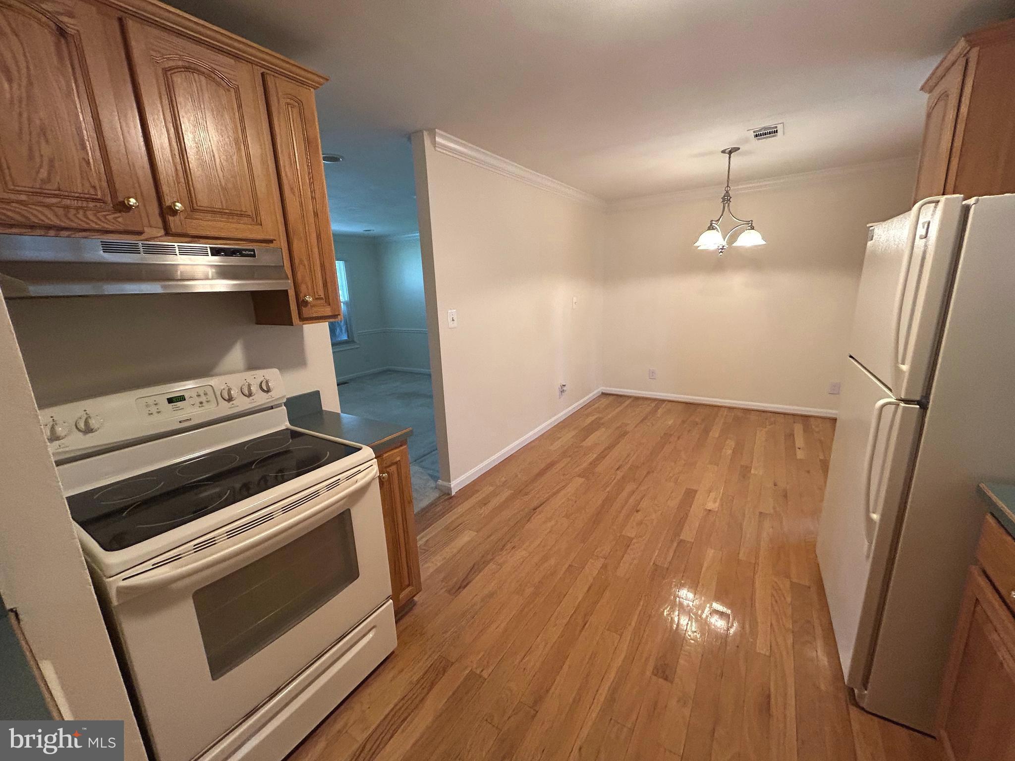 111 North Hickory Road Sterling, VA 20164 - Photo 19 of 30 a stove top oven sitting inside of a kitchen