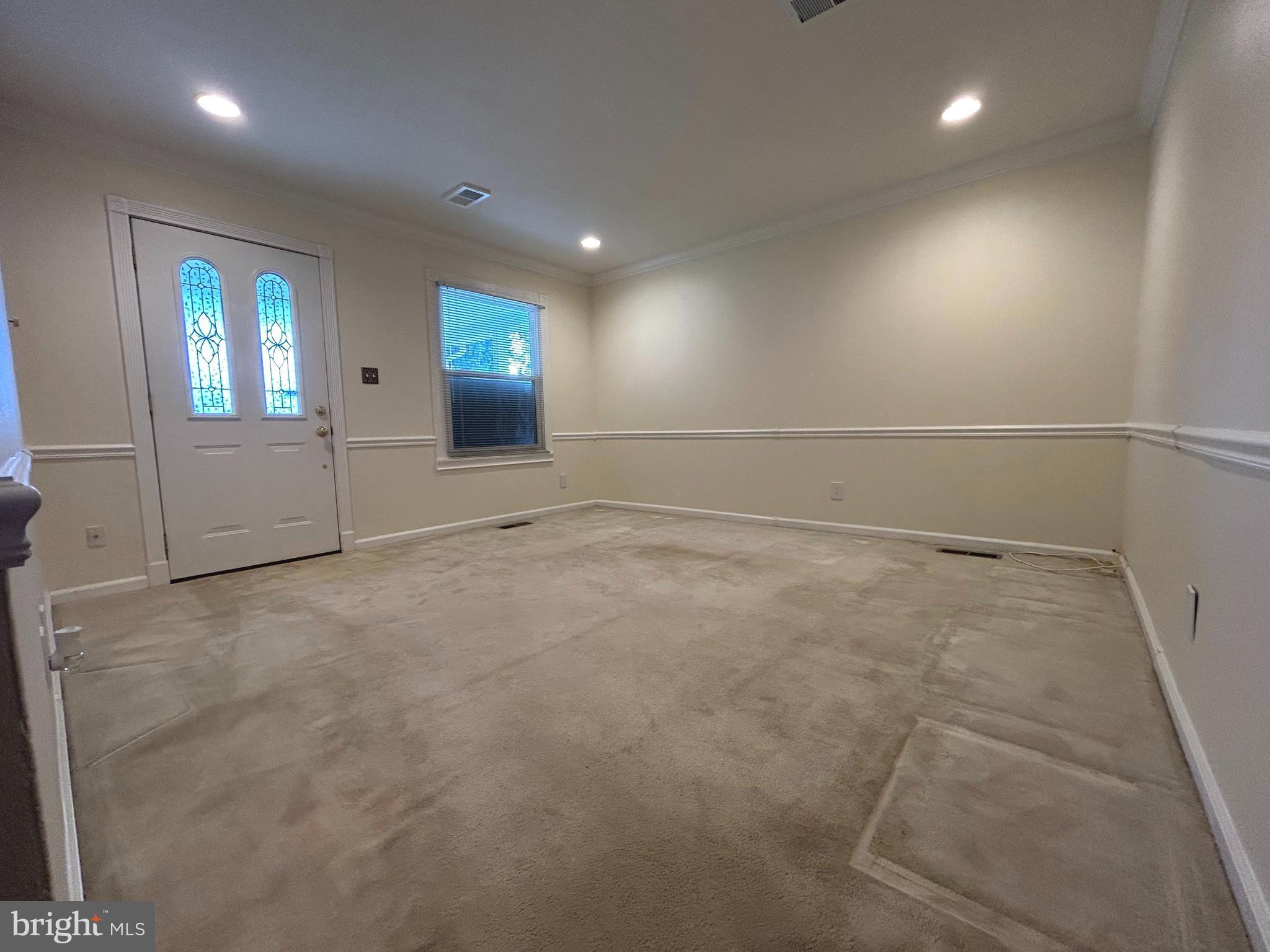 111 North Hickory Road Sterling, VA 20164 - Photo 22 of 30 an empty room with windows and entrance