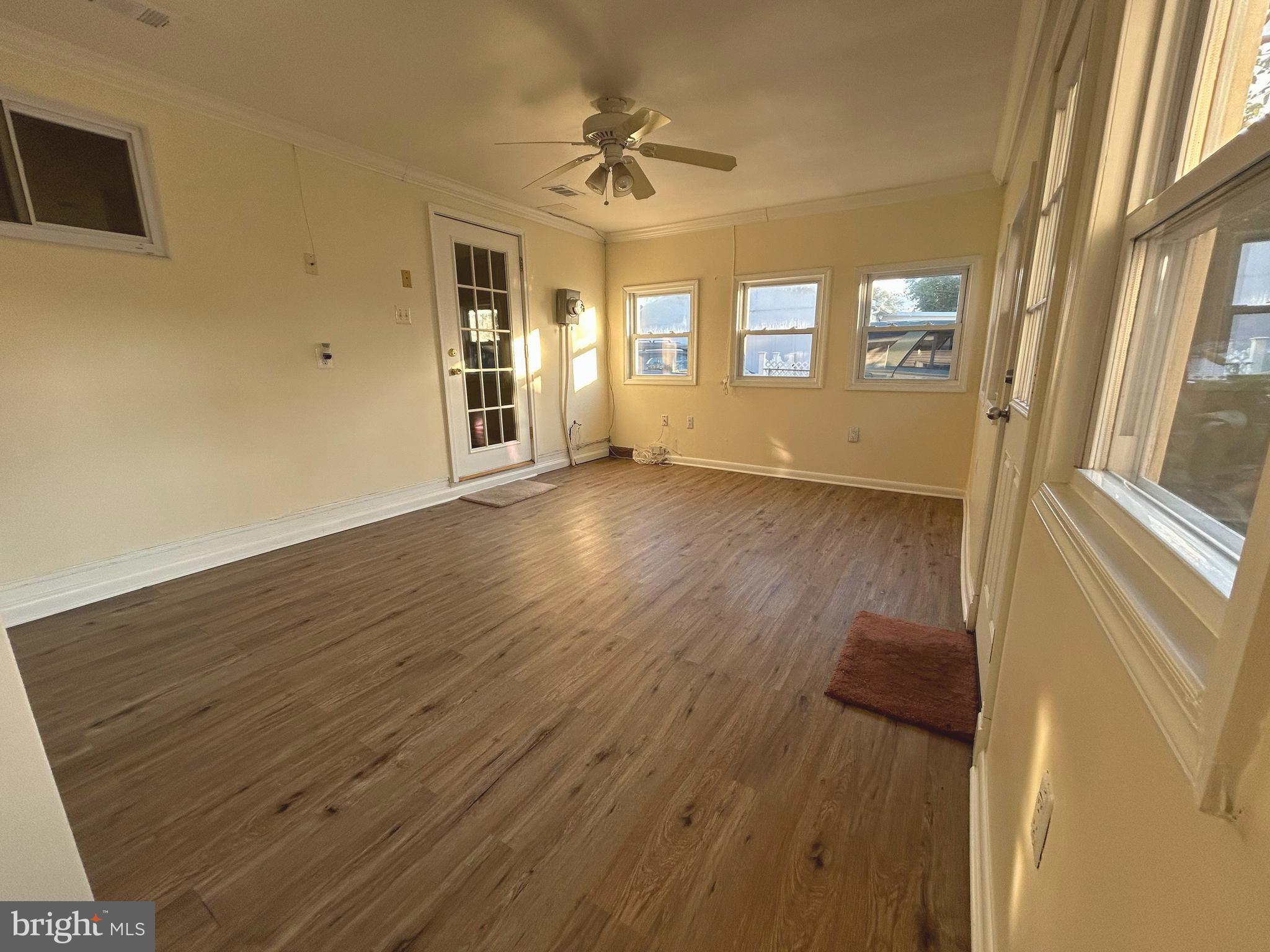 111 North Hickory Road Sterling, VA 20164 - Photo 29 of 30 a view of an empty room with a window and wooden floor