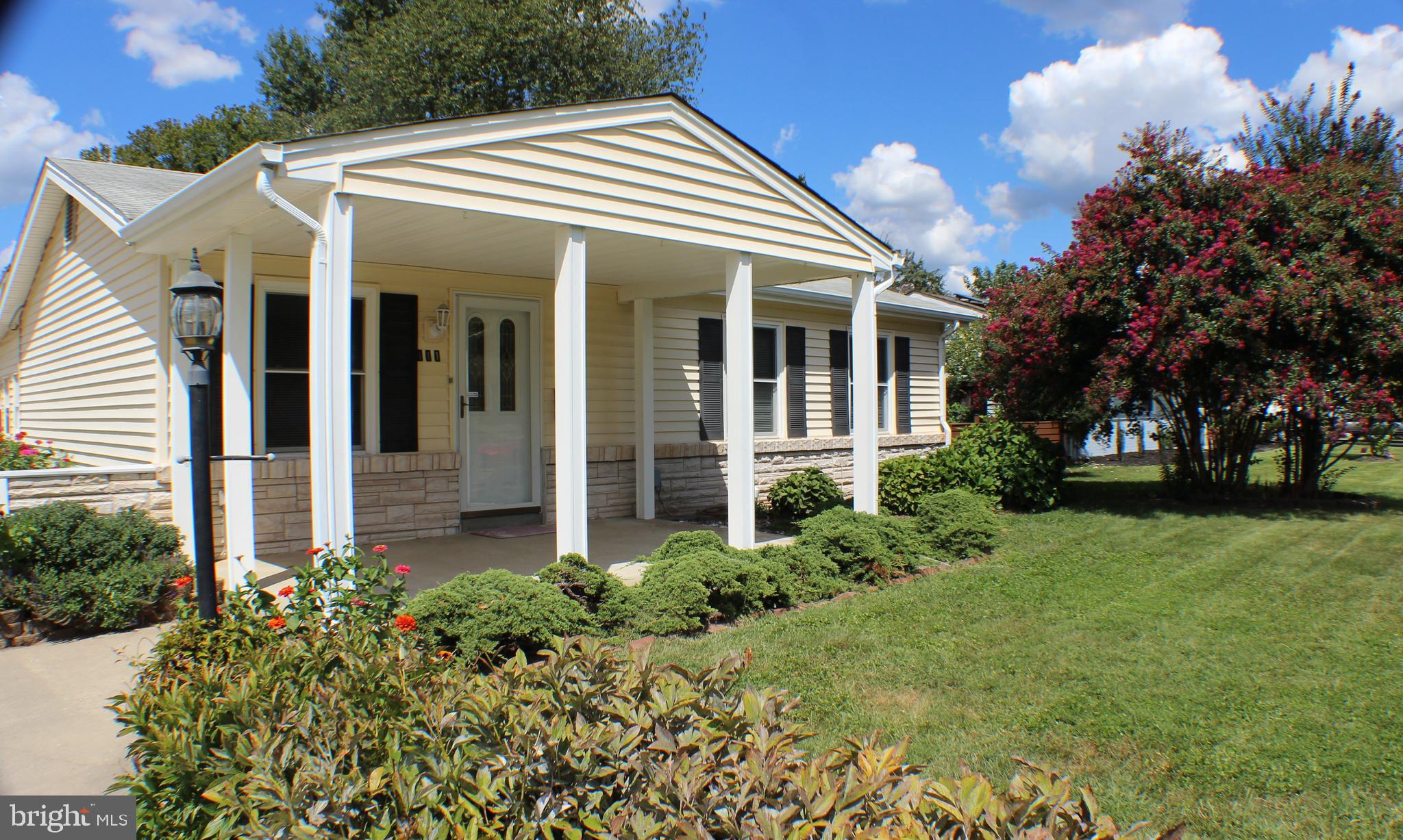 111 North Hickory Road Sterling, VA 20164 - Photo 5 of 30 a front view of a house with garden