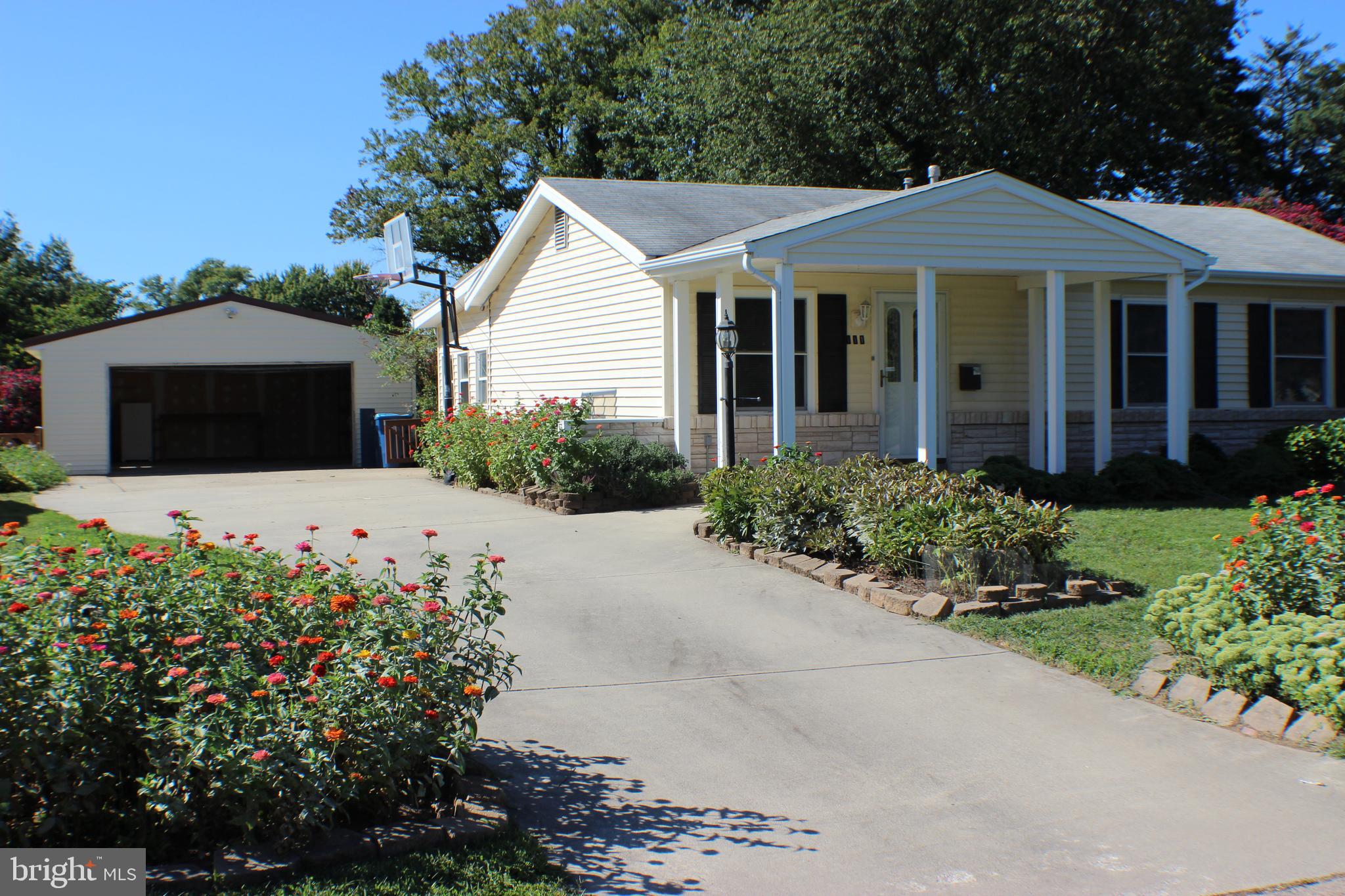 111 North Hickory Road Sterling, VA 20164 - Photo 7 of 30 a front view of a house with a garden