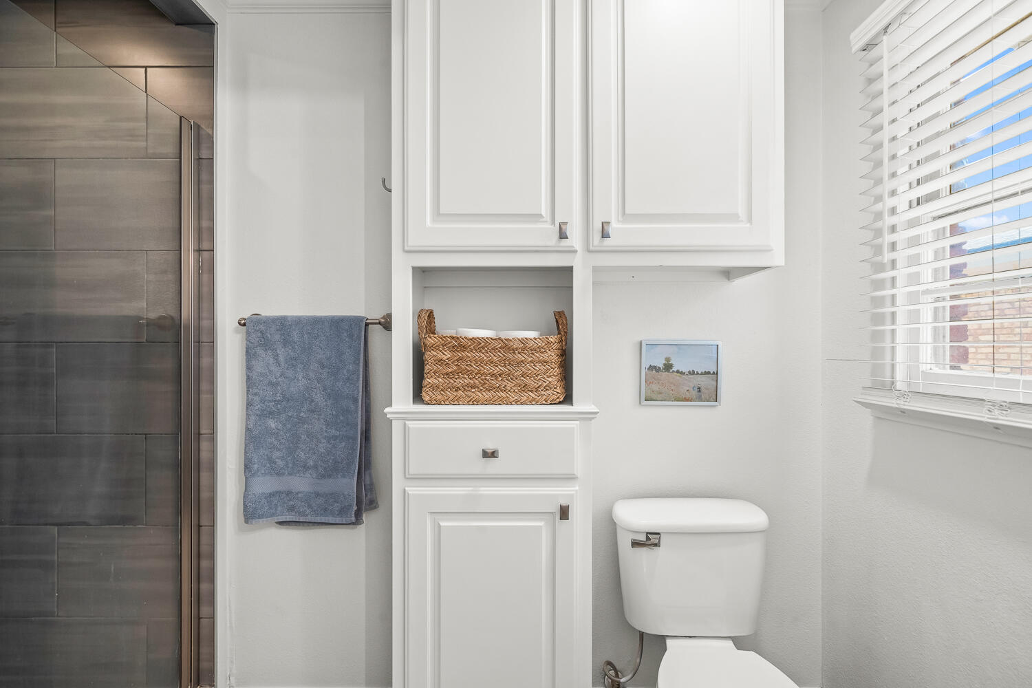 3418 62nd Street Lubbock, TX 79413 - Photo 23 of 45 a white toilet sitting next to a bathroom sink