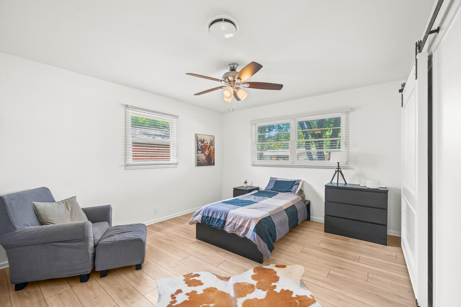 3418 62nd Street Lubbock, TX 79413 - Photo 30 of 45 a bed room with a bed and a couch