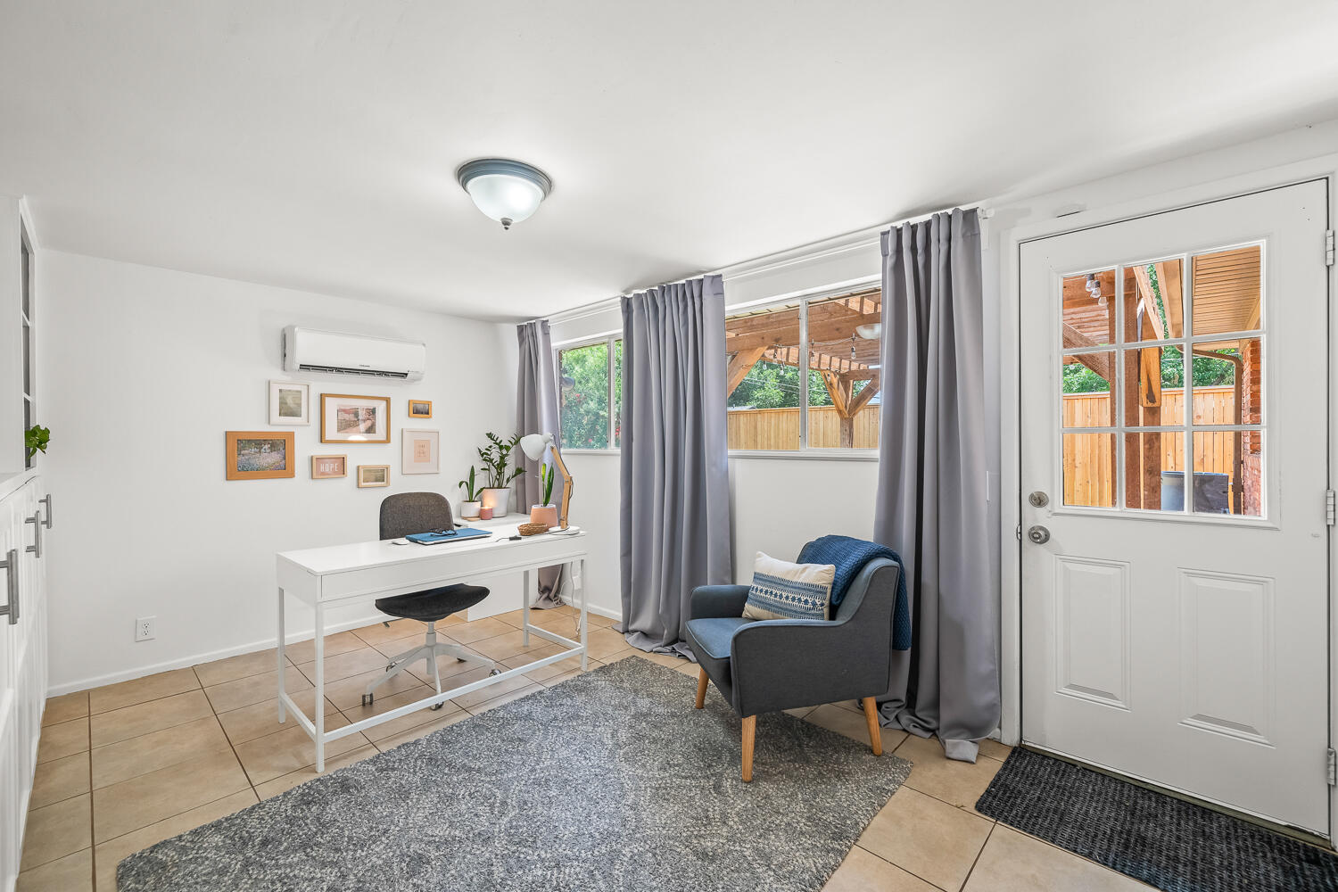 3418 62nd Street Lubbock, TX 79413 - Photo 31 of 45 a living room with furniture and a window