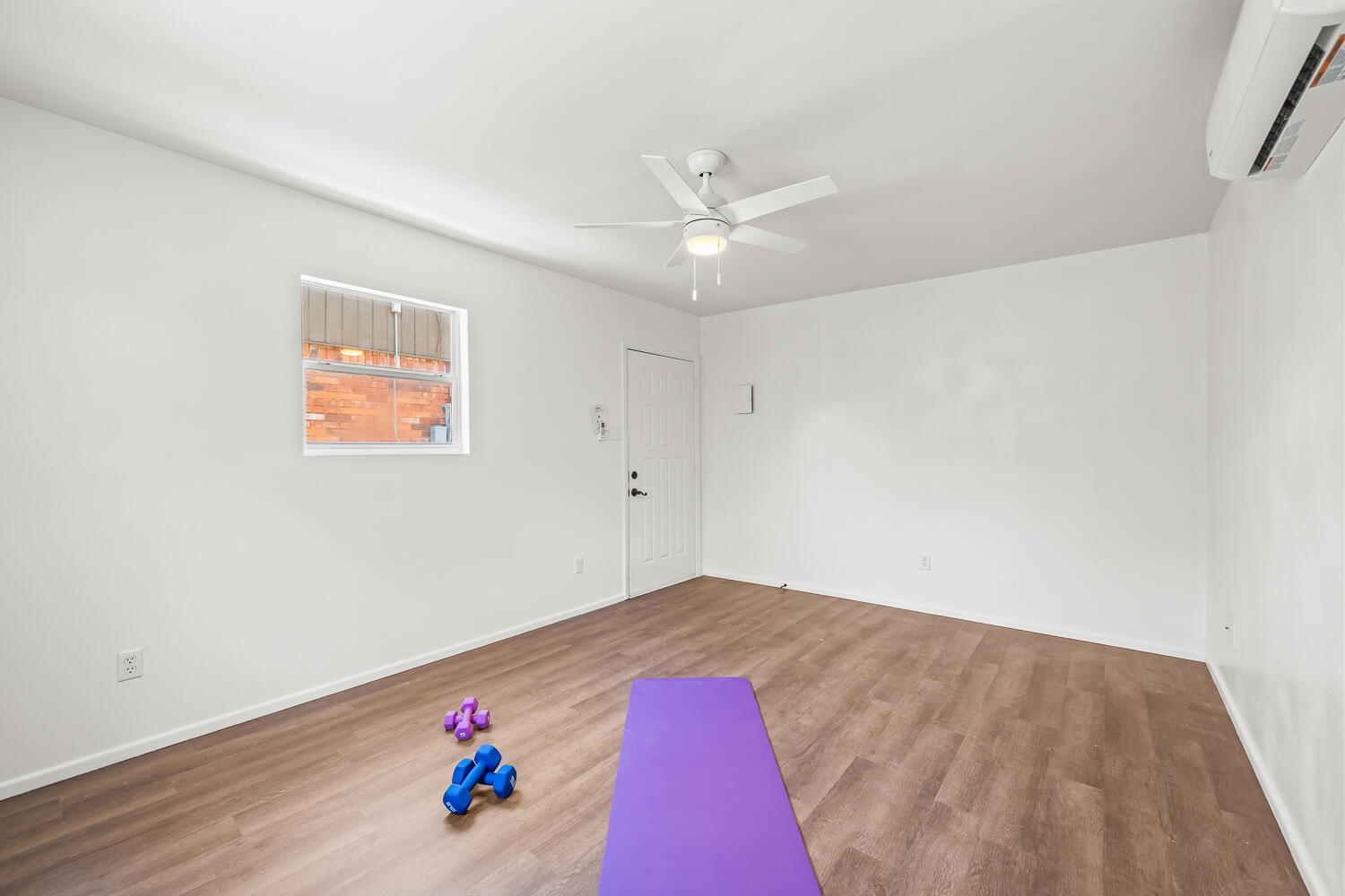 3418 62nd Street Lubbock, TX 79413 - Photo 35 of 45 an empty room with wooden floor and ceiling fan