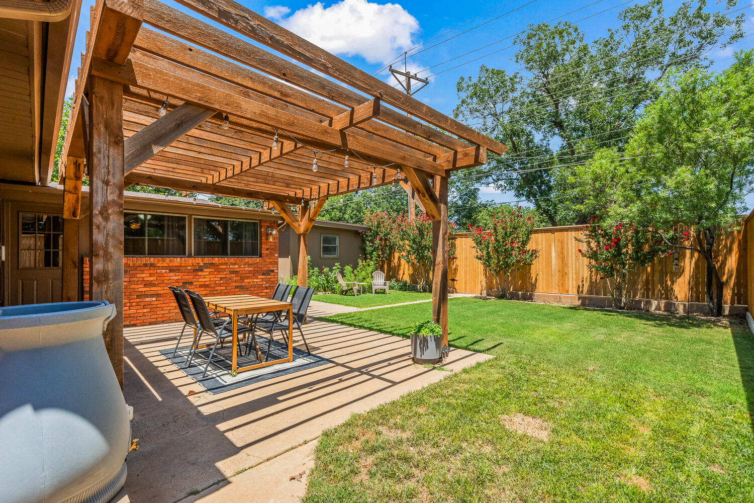 3418 62nd Street Lubbock, TX 79413 - Photo 39 of 45 a view of outdoor space yard deck patio and swimming pool