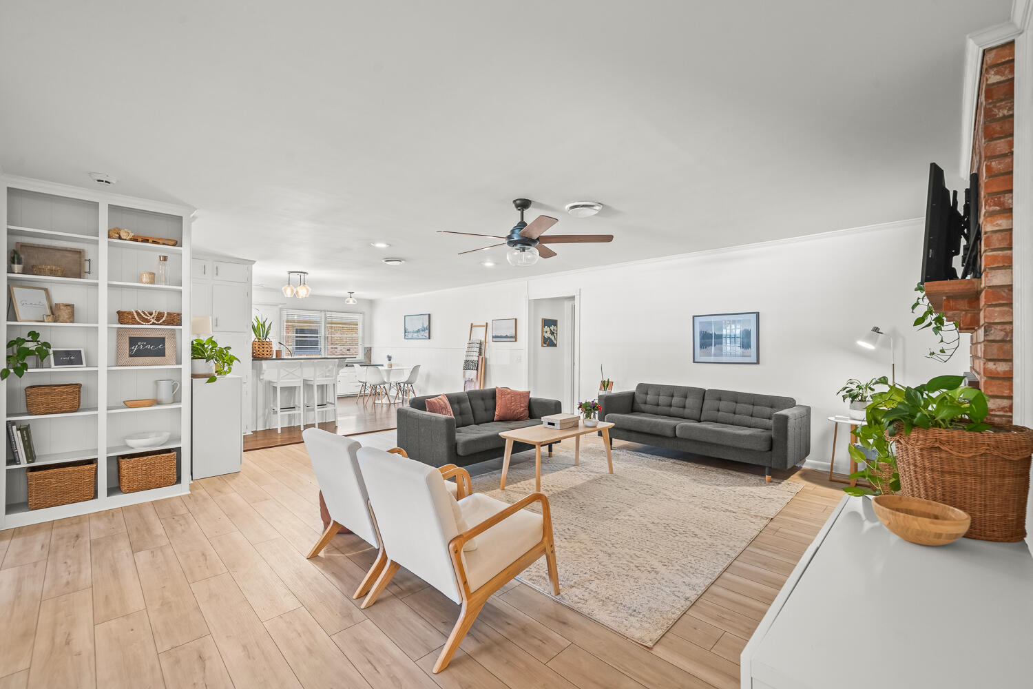 3418 62nd Street Lubbock, TX 79413 - Photo 4 of 45 a living room with furniture and a book shelf