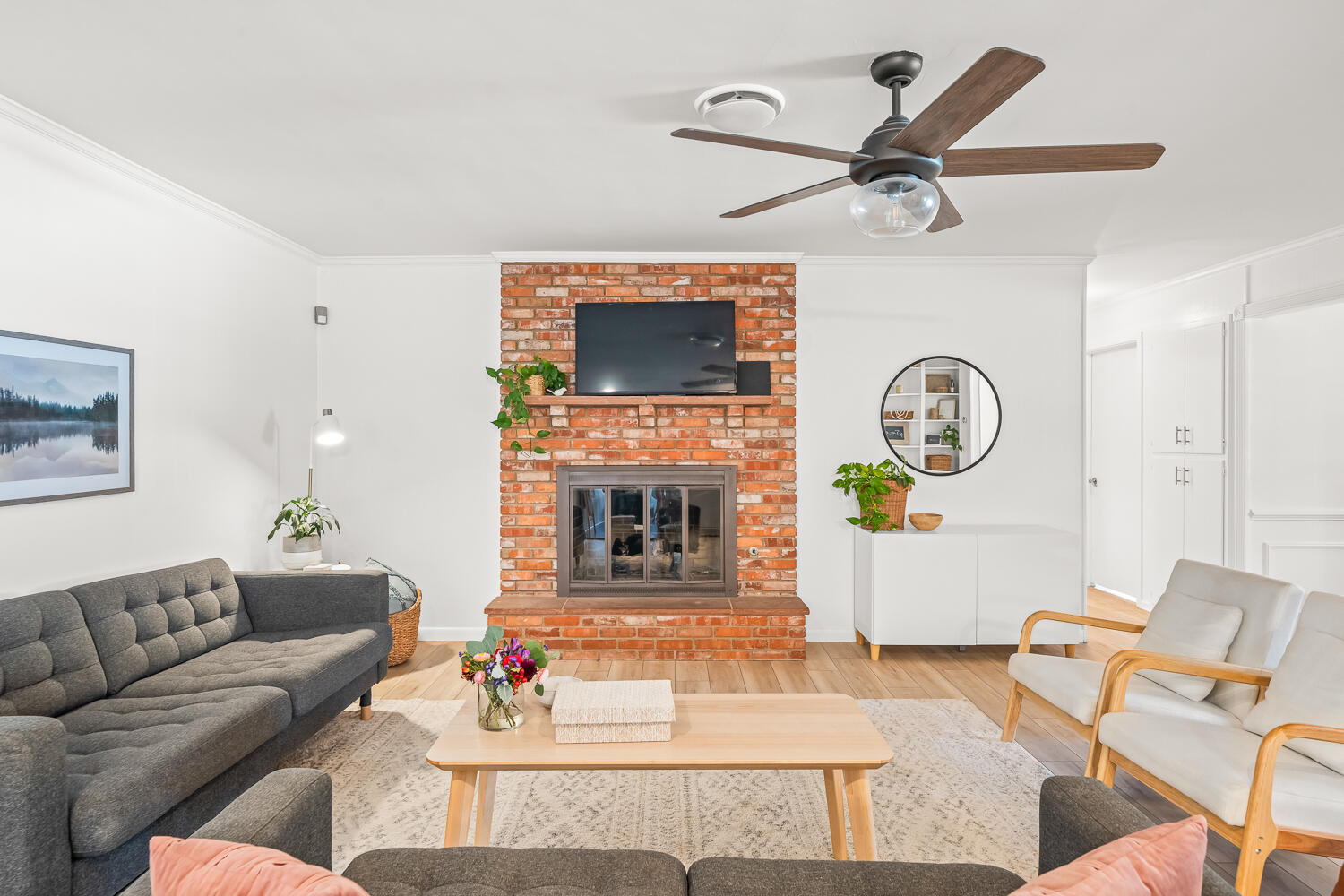3418 62nd Street Lubbock, TX 79413 - Photo 6 of 45 a living room with furniture a fireplace and a large window