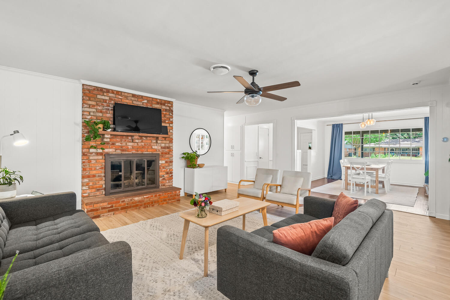3418 62nd Street Lubbock, TX 79413 - Photo 7 of 45 a living room with fireplace furniture and a flat screen tv