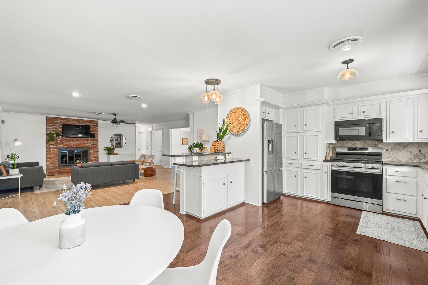 3418 62nd Street Lubbock, TX 79413 - Photo 9 of 45 a large white kitchen with stainless steel appliances