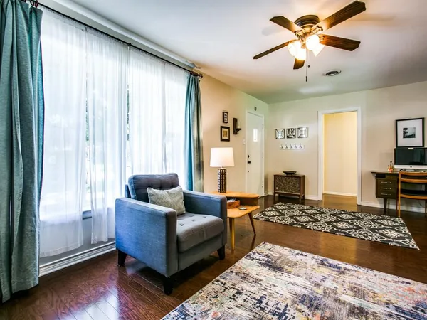 a living room with furniture and a rug