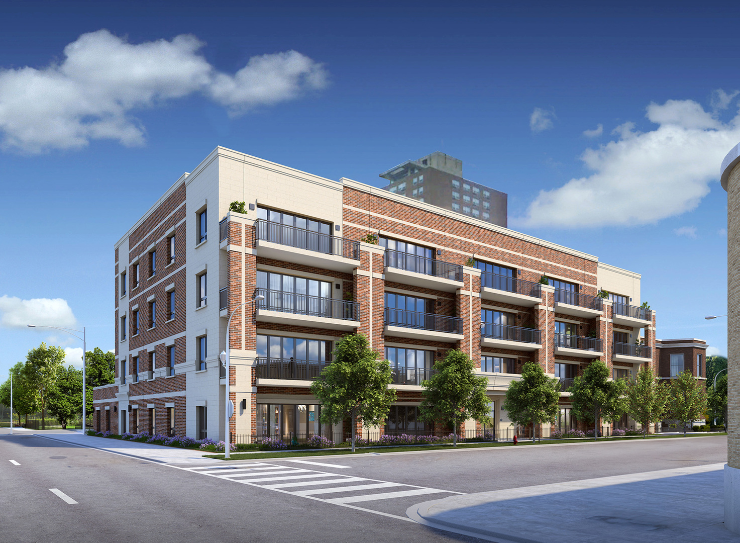a front view of multi story residential apartment building with yard and traffic signal