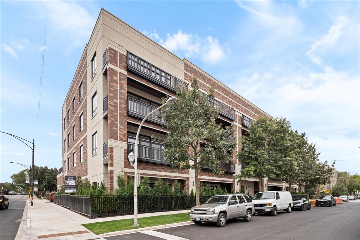 3951 North Wayne Avenue, Unit 304 Chicago, IL 60613 - Photo 3 of 20 a view of a car parked in front of a building