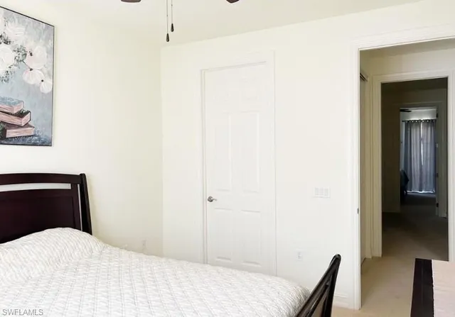 a bedroom with a bed and a chair