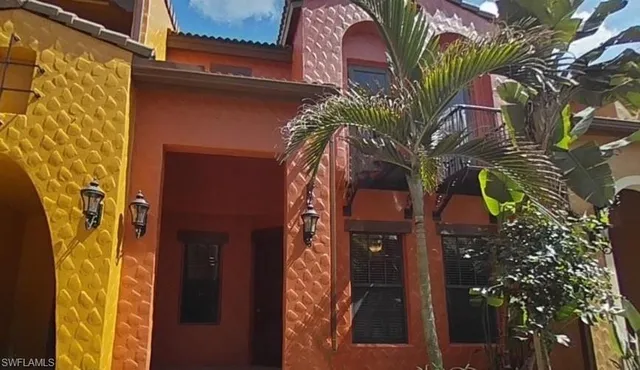a view of a house with a tree
