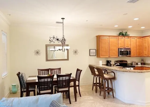 a view of a dining room with furniture