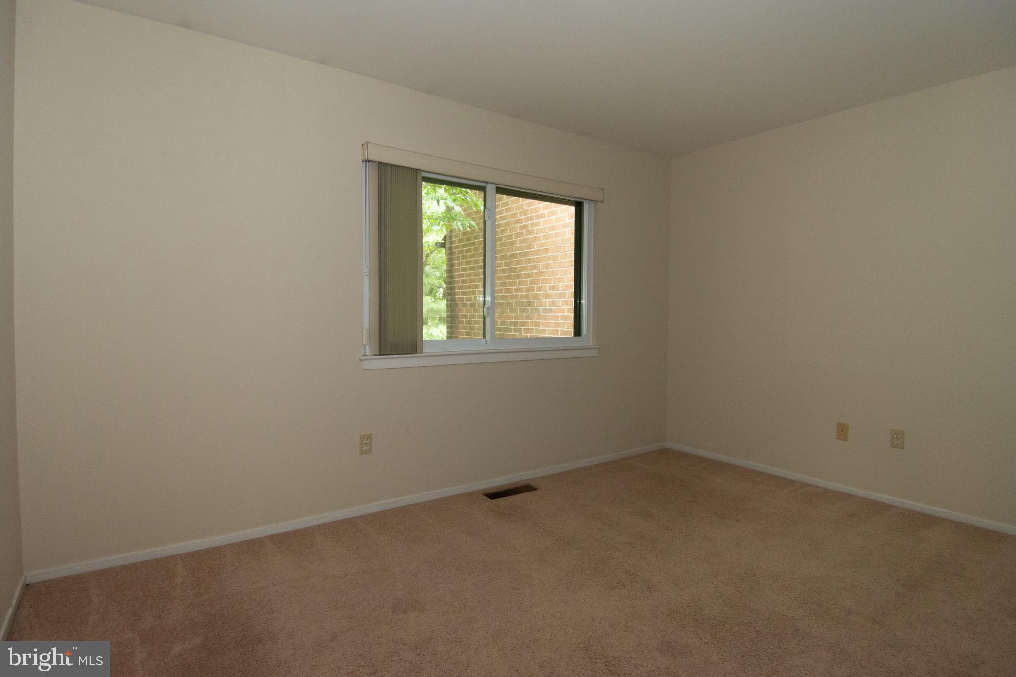 11768 Indian Ridge Road Reston, VA 20191 - Photo 17 of 57 an empty room with a window