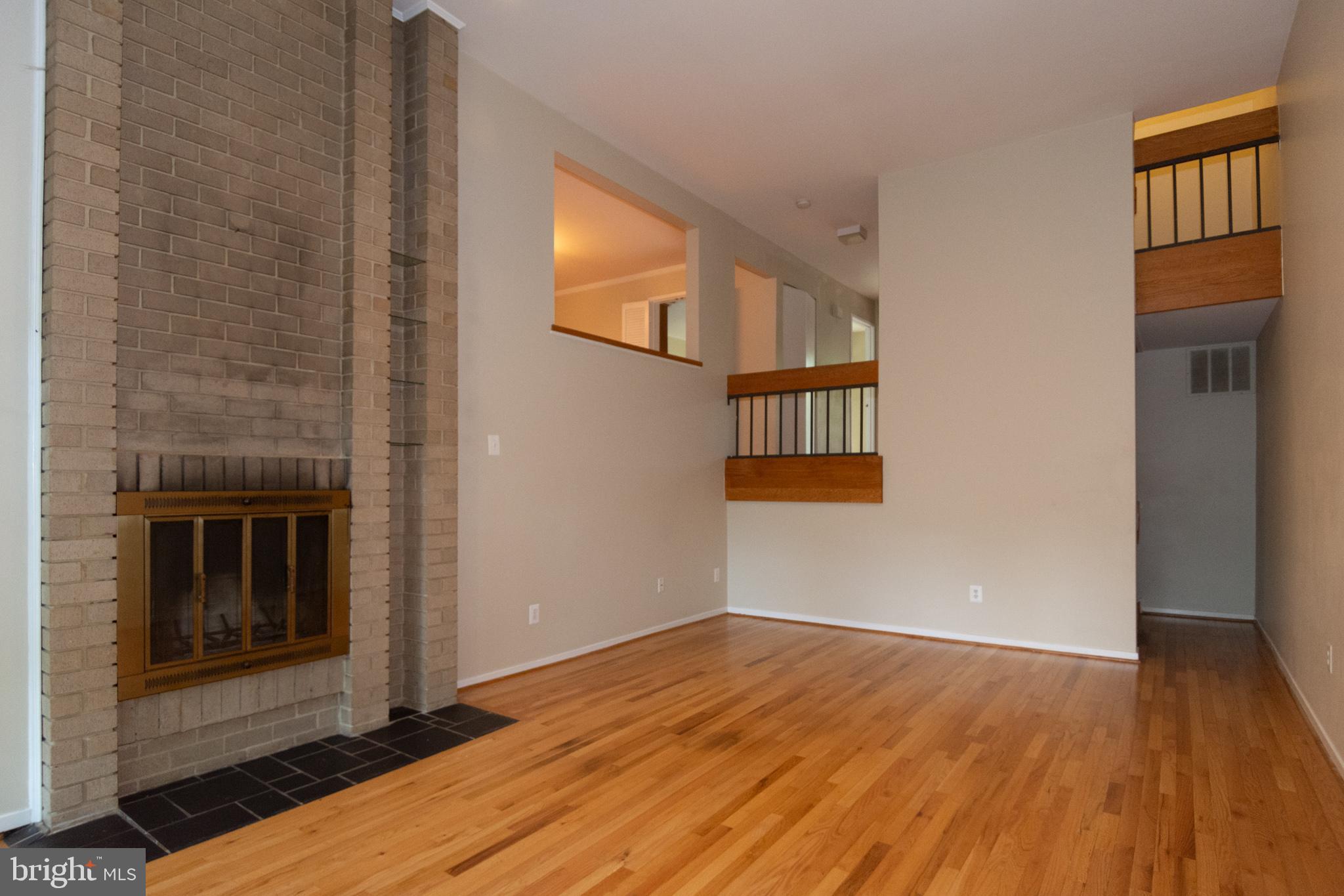 11768 Indian Ridge Road Reston, VA 20191 - Photo 28 of 57 a view of an empty room with wooden floor and a window