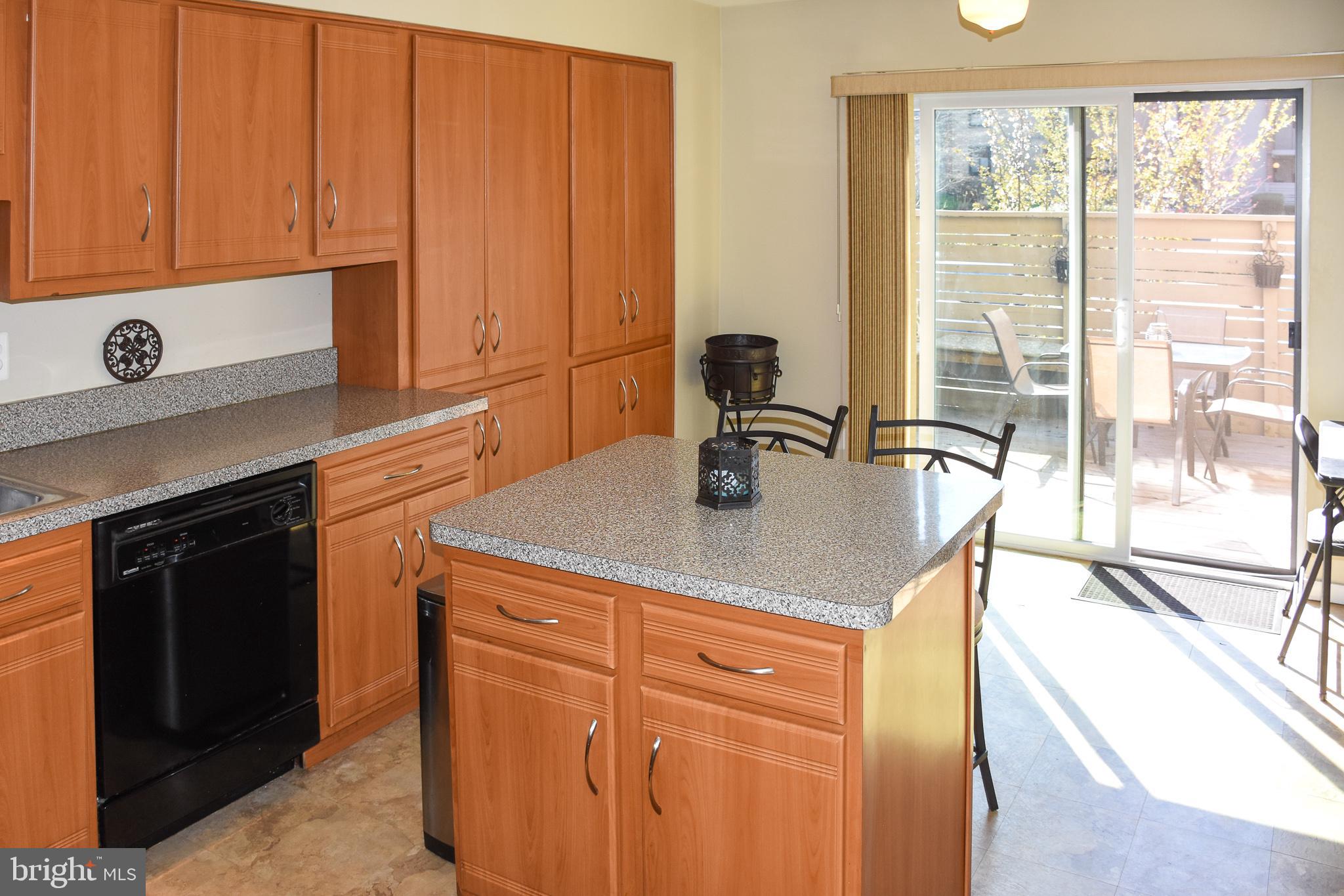 11768 Indian Ridge Road Reston, VA 20191 - Photo 4 of 57 a kitchen with stainless steel appliances granite countertop a sink and cabinets