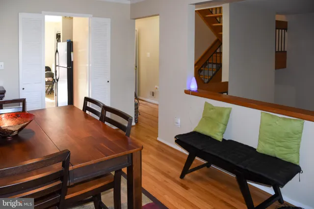 a living room with chairs and a table
