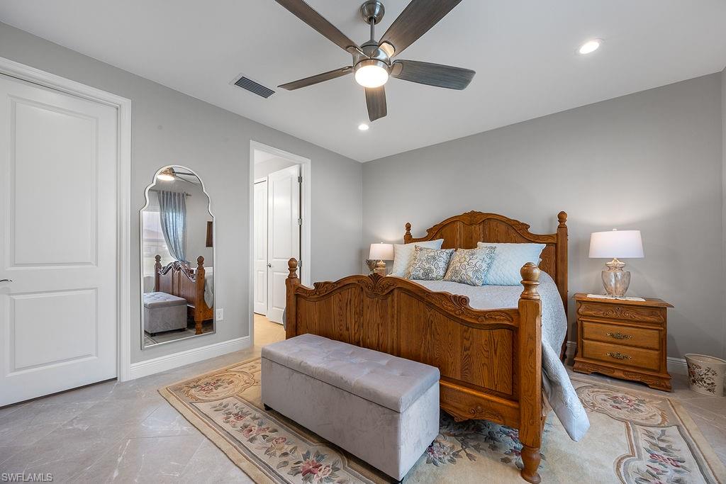 4584 Centaurus Circle Naples, FL 34120 - Photo 23 of 40 Bedroom with ceiling fan and recessed lighting