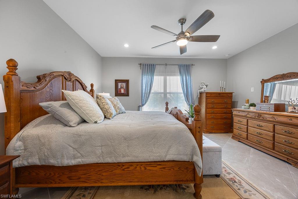 4584 Centaurus Circle Naples, FL 34120 - Photo 24 of 40 Bedroom featuring ceiling fan, recessed lighting, and light tile patterned flooring