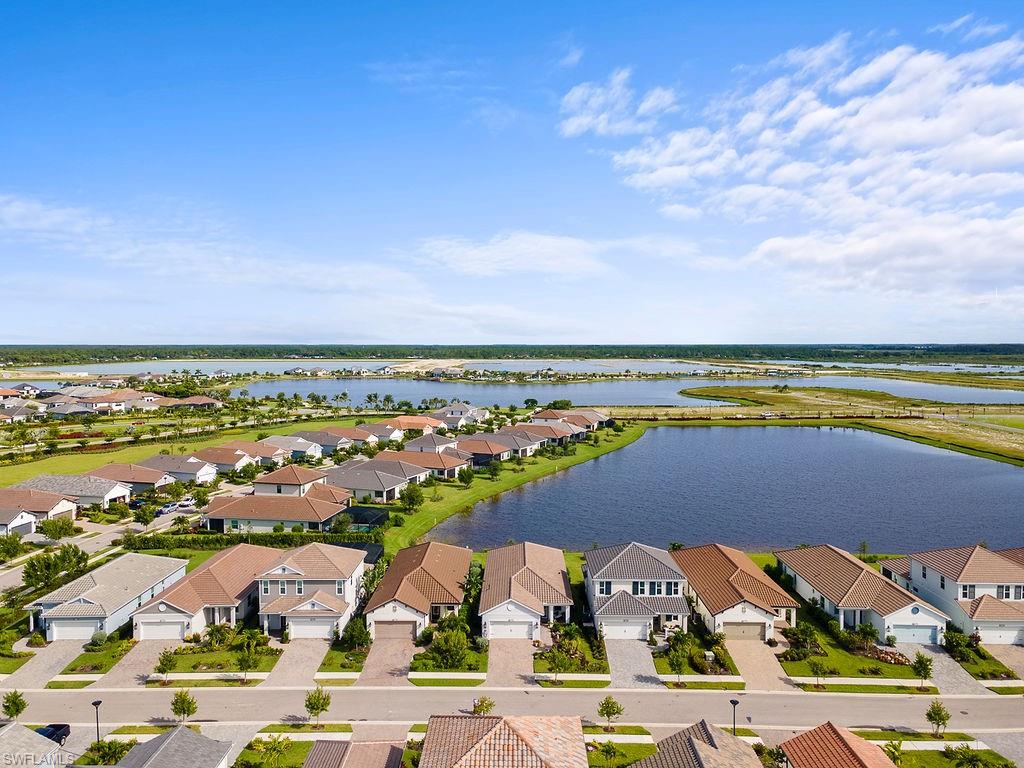 4584 Centaurus Circle Naples, FL 34120 - Photo 33 of 40 Aerial perspective of suburban area with a nearby body of water