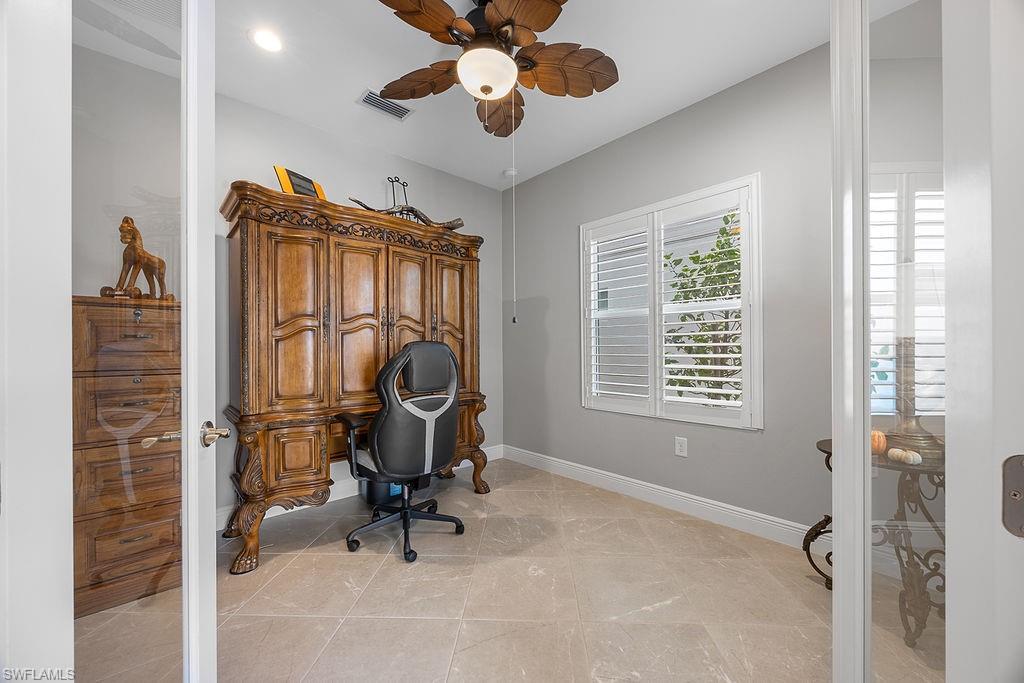 4584 Centaurus Circle Naples, FL 34120 - Photo 4 of 40 Home office featuring ceiling fan and light tile patterned floors