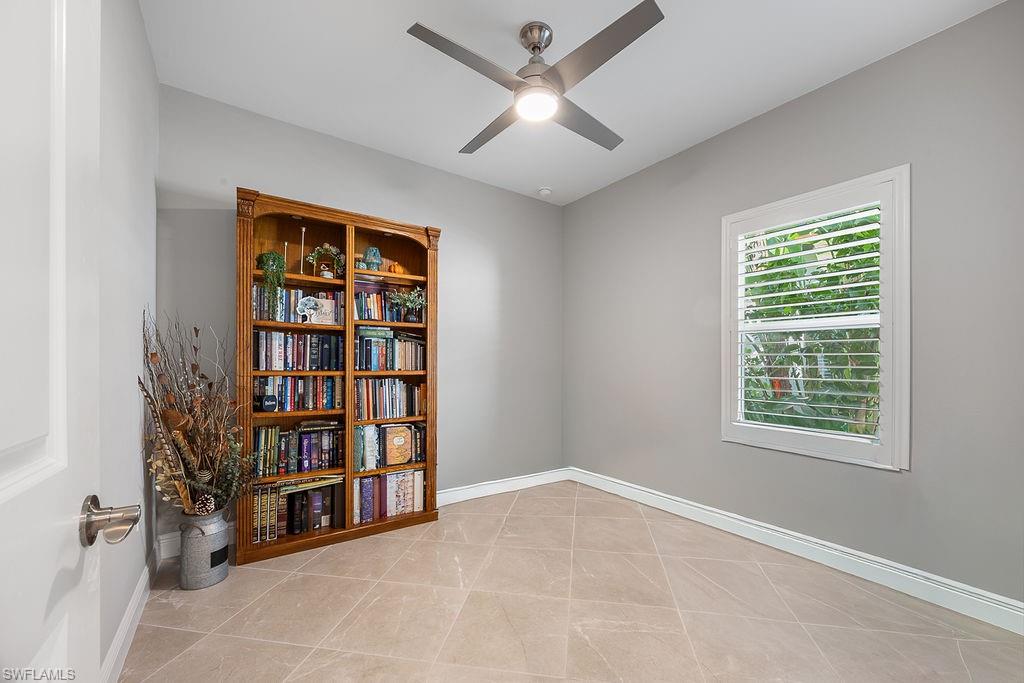 4584 Centaurus Circle Naples, FL 34120 - Photo 9 of 40 Unfurnished room featuring light tile patterned floors and a ceiling fan
