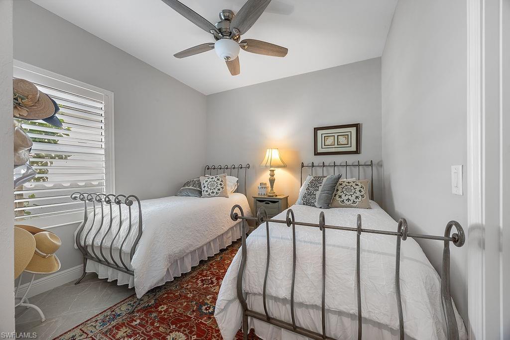 4584 Centaurus Circle Naples, FL 34120 - Photo 10 of 40 Bedroom with ceiling fan and tile patterned floors