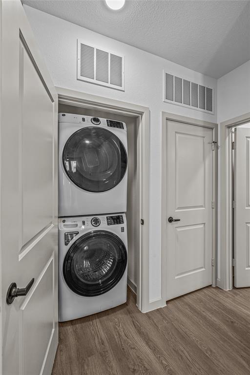 7455 West Camp Wisdom Road, Unit 4309 Dallas, TX 75236 - Photo 10 of 15 a view of a hallway with washer and dryer