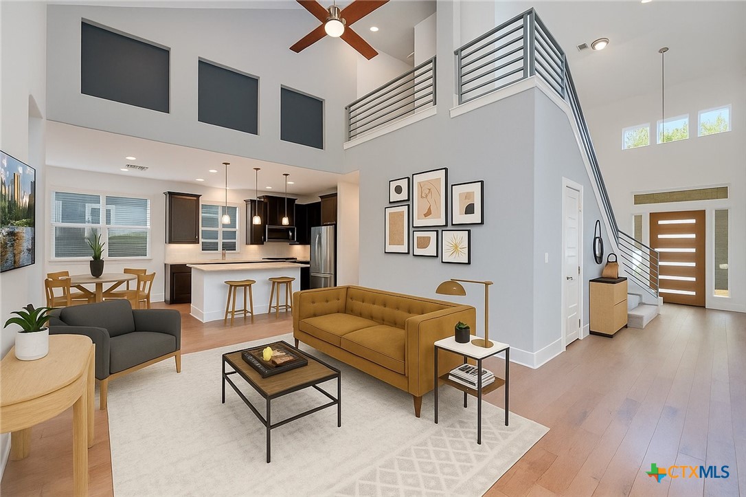 2205 Capulet Street Austin, TX 78741 - Photo 1 of 22 a living room with furniture and wooden floor