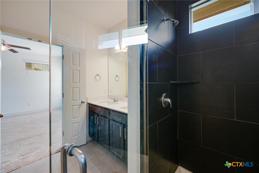 2205 Capulet Street Austin, TX 78741 - Photo 17 of 22 a bathroom with a shower and a sink