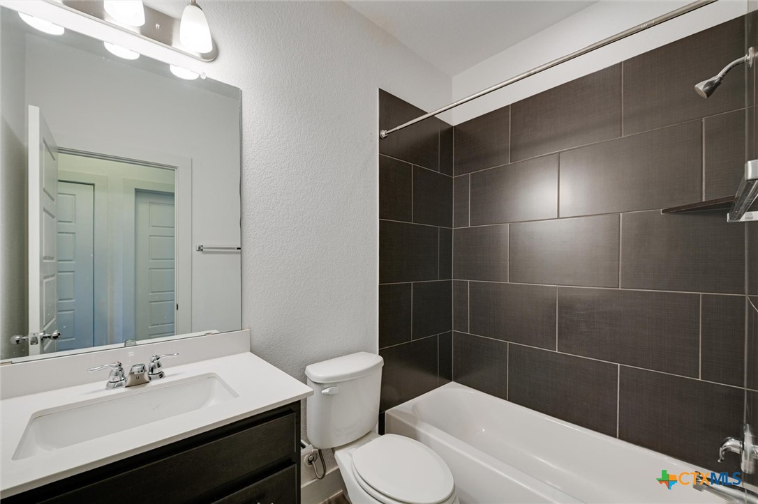 2205 Capulet Street Austin, TX 78741 - Photo 20 of 22 a bathroom with a sink a toilet and shower
