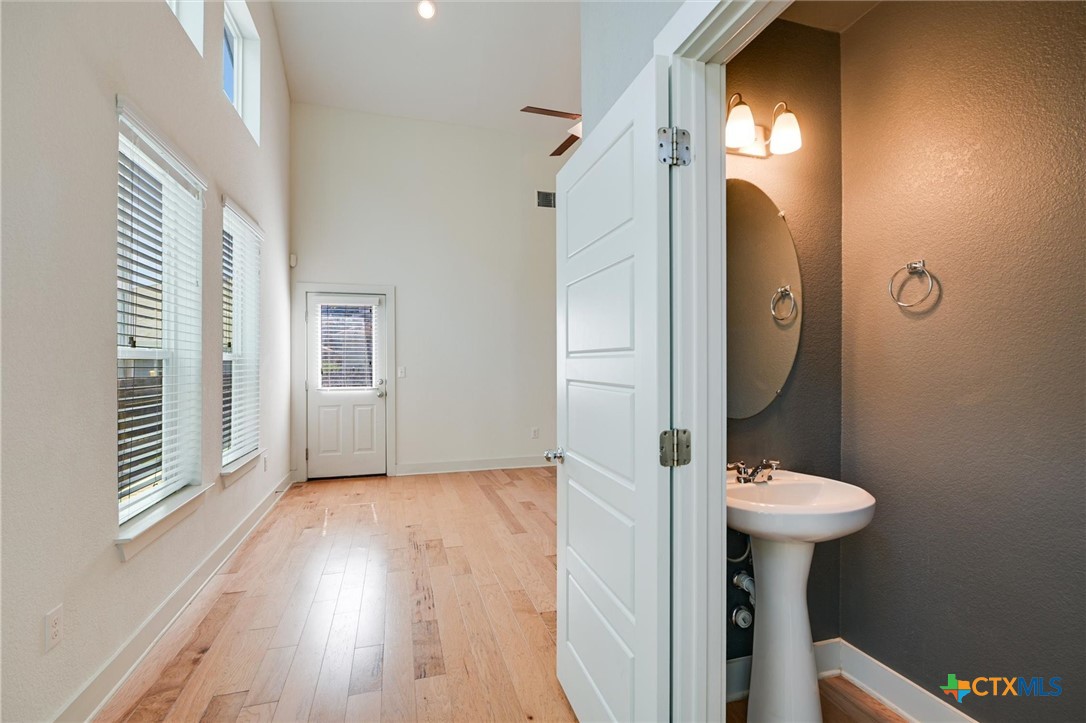 2205 Capulet Street Austin, TX 78741 - Photo 22 of 22 a bathroom with a sink and a mirror