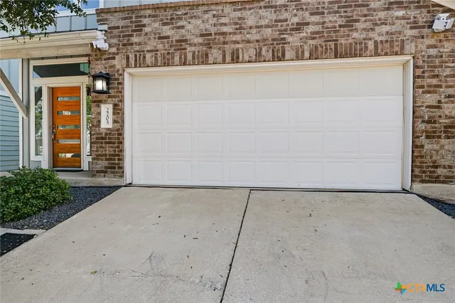 a view of a brick house with a street