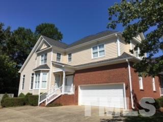 9101 Carrington Ridge Drive Raleigh, NC 27615 - Photo 1 of 14 a front view of a house with a yard