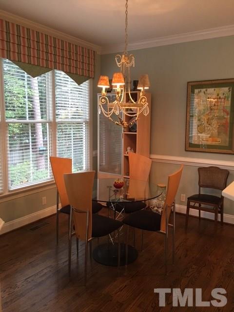 9101 Carrington Ridge Drive Raleigh, NC 27615 - Photo 9 of 14 a dining room with furniture and window