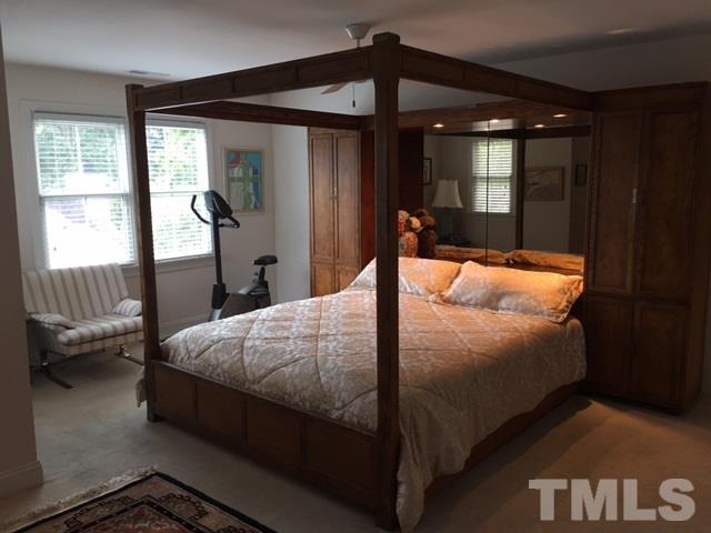 9101 Carrington Ridge Drive Raleigh, NC 27615 - Photo 10 of 14 a bedroom with a bed and large window