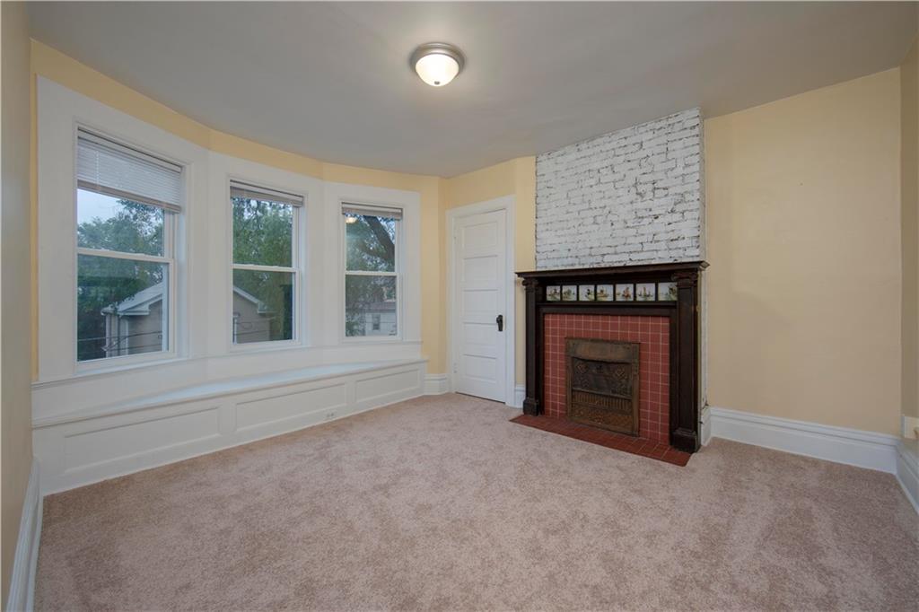 101 Shadyhill Road Pittsburgh, PA 15205 - Photo 14 of 25 BEDROOM - Located on the second floor featuring a wall of windows, tiled windmill design fireplace and window seat.