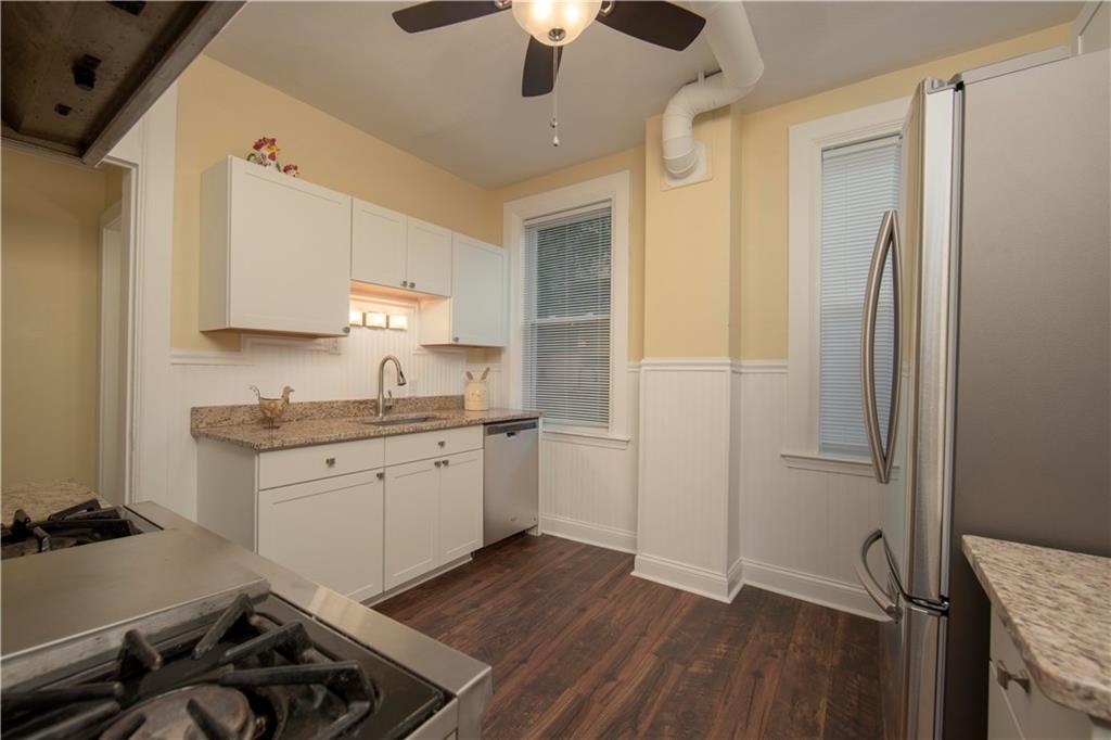 101 Shadyhill Road Pittsburgh, PA 15205 - Photo 9 of 25 KITCHEN - Updated kitchen with granite counter tops and stainless steel appliances. Just waiting for a new chef. Easy flow throughout the main floor to the kitchen guarantees a lifestyle of convenience for a busy family.