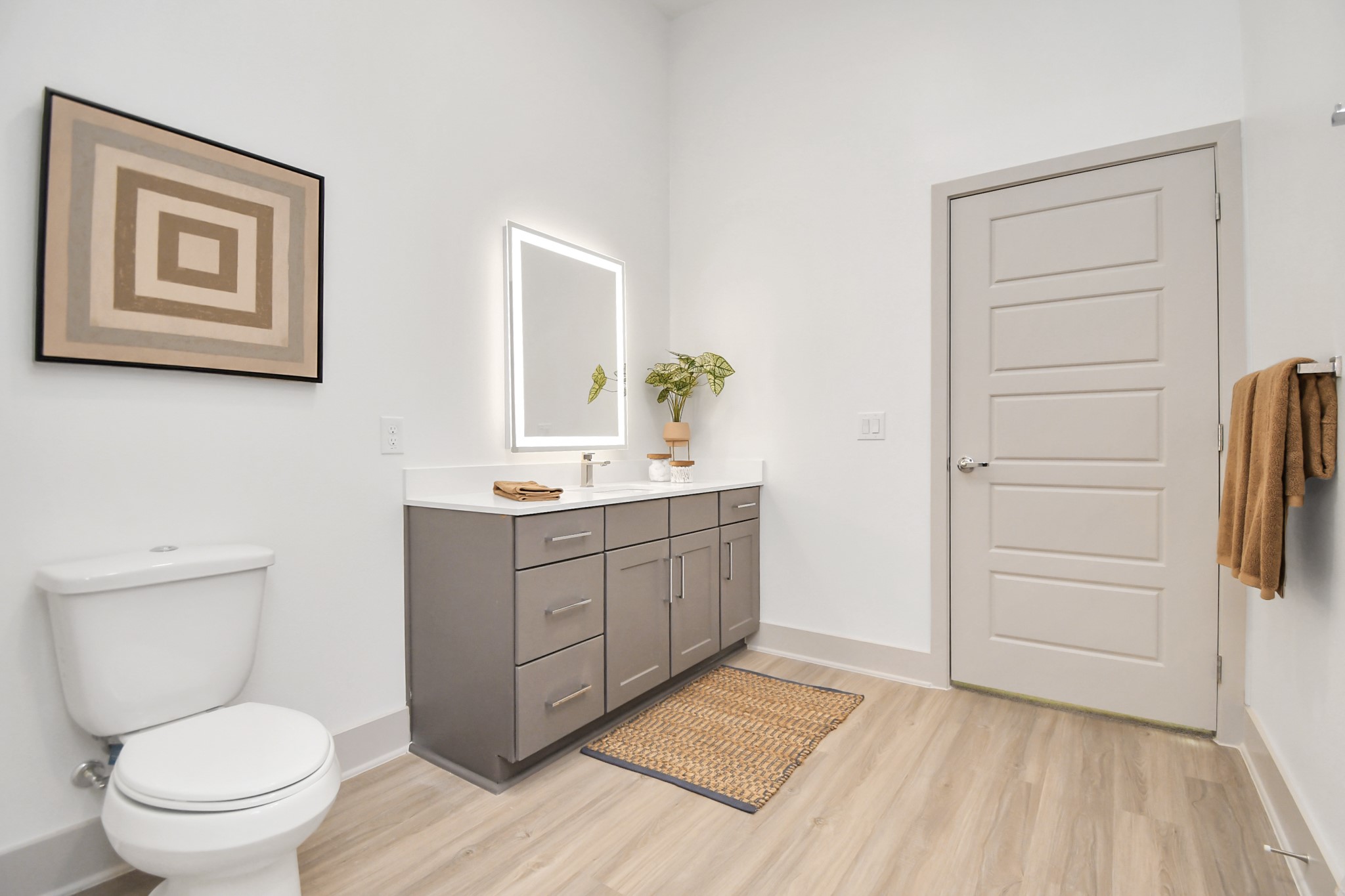 1617 Enid Street, Unit 177 Houston, TX 77009 - Photo 26 of 50 a spacious bathroom with a toilet a sink a mirror and vanity