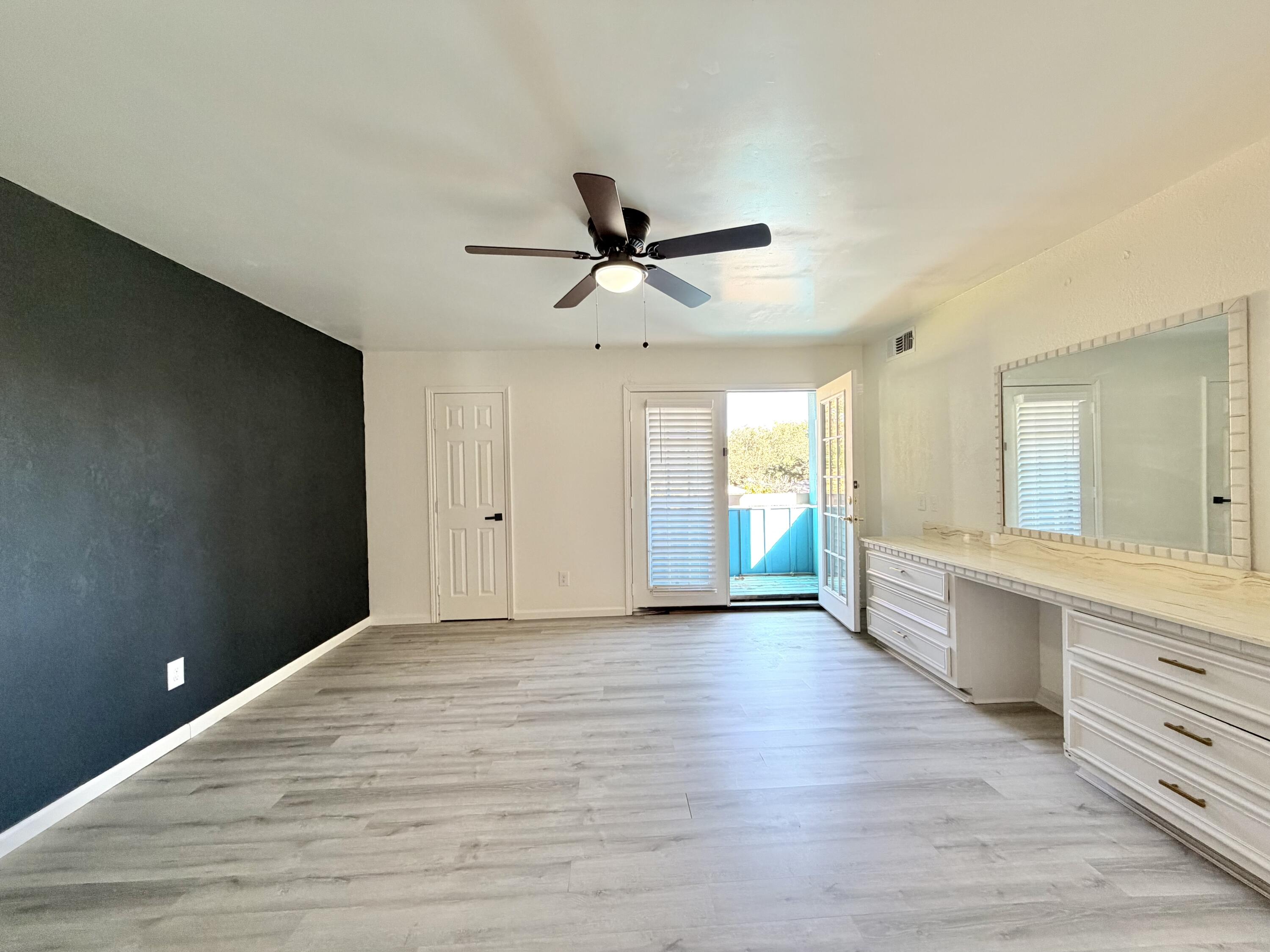 3407 30th Street Lubbock, TX 79410 - Photo 13 of 26 a view of an empty room with window and cabinet