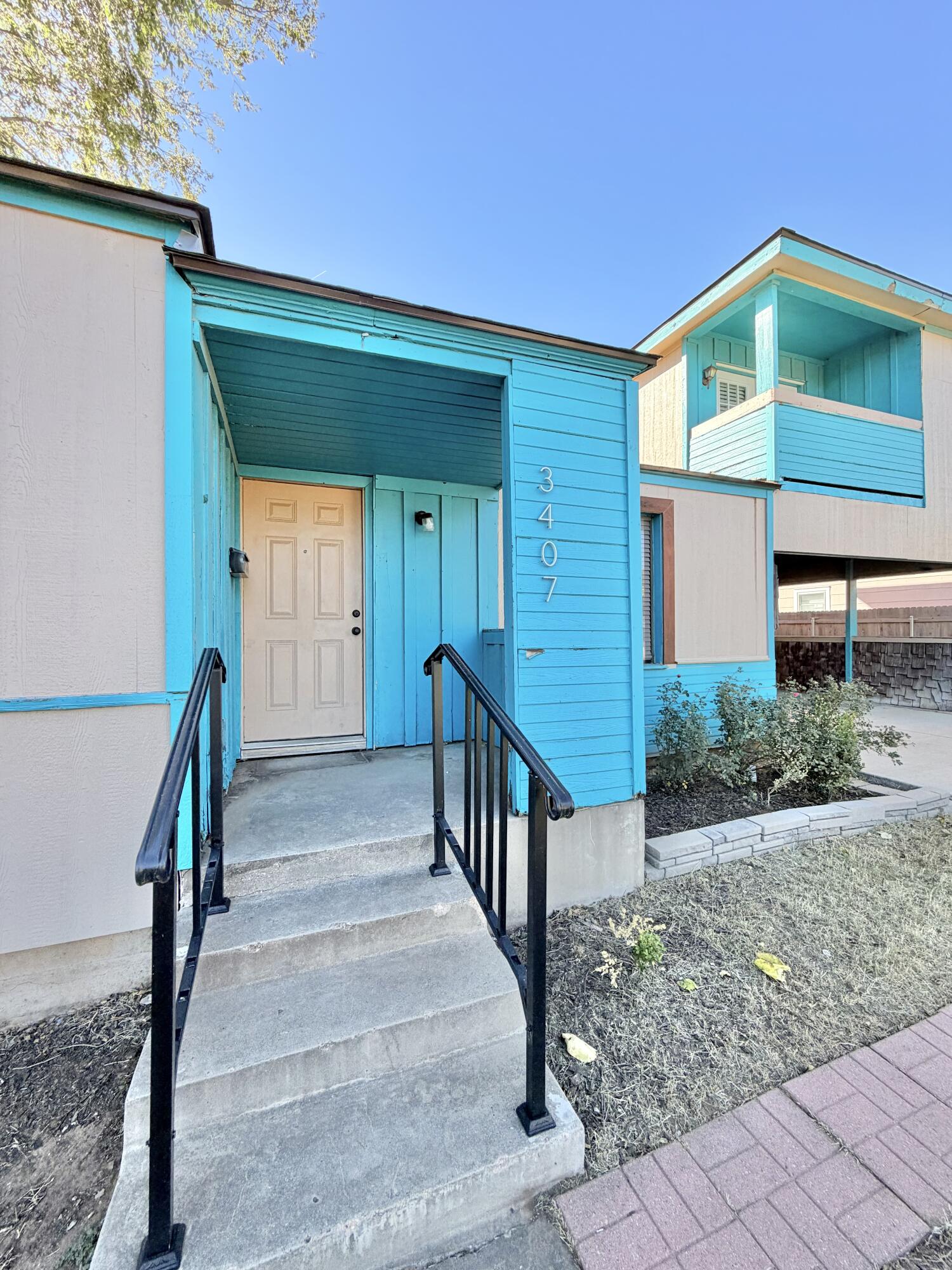 3407 30th Street Lubbock, TX 79410 - Photo 2 of 26 a front view of a house with deck