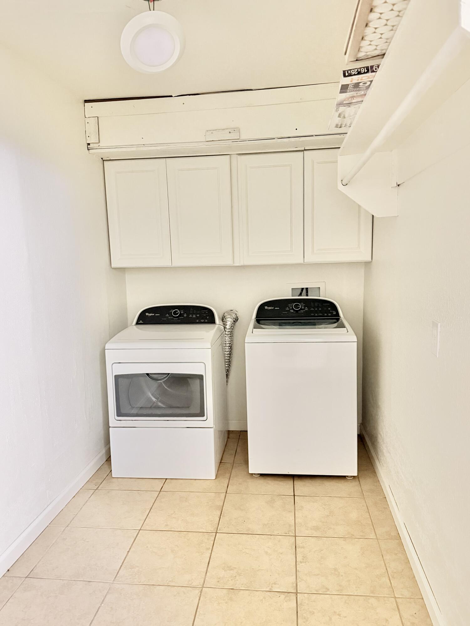 3407 30th Street Lubbock, TX 79410 - Photo 24 of 26 a utility room with sink dryer and washer