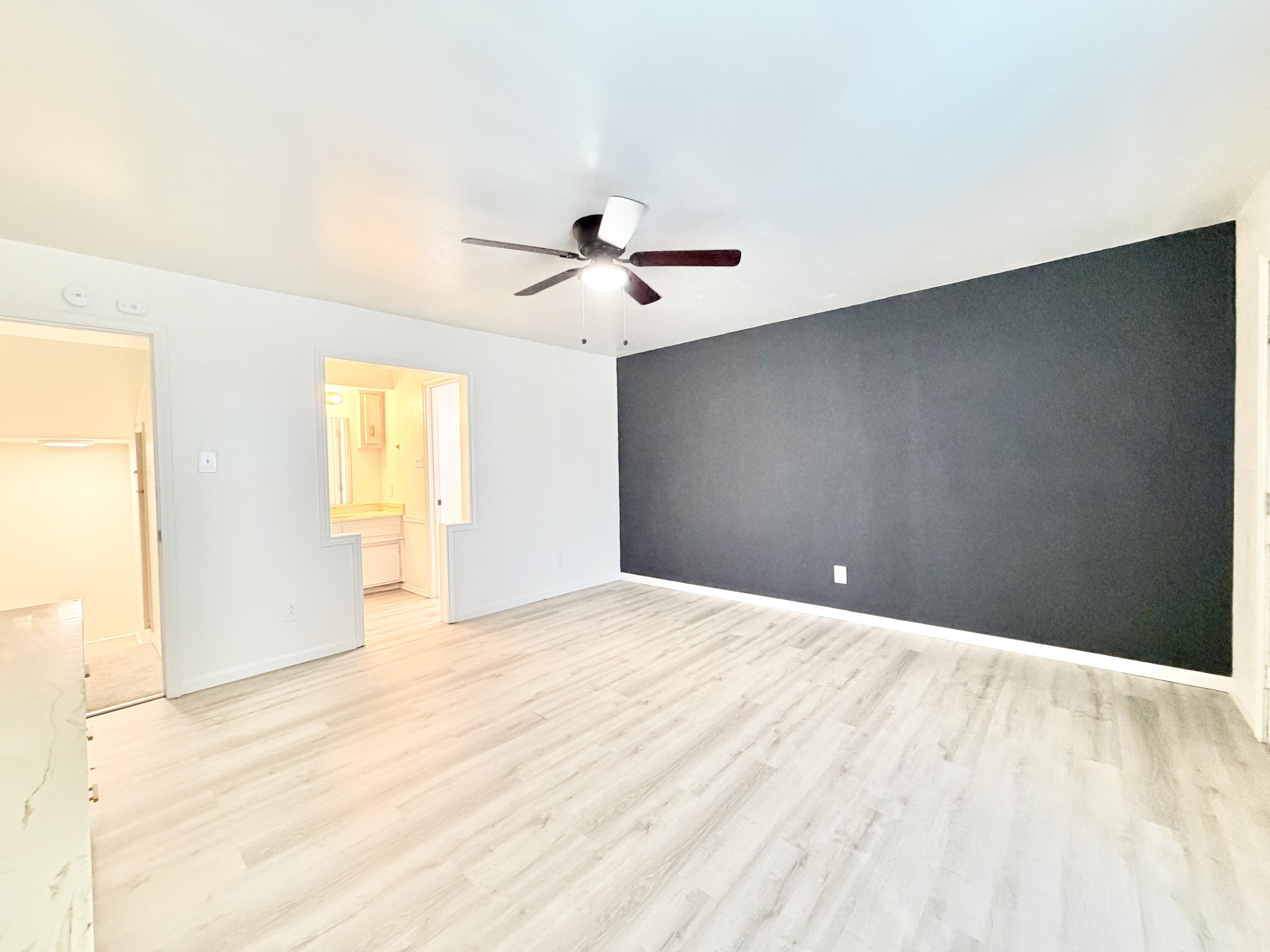 3407 30th Street Lubbock, TX 79410 - Photo 9 of 26 a view of a livingroom with a ceiling fan and window