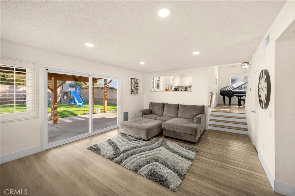 7077 Campbell Place Rancho Cucamonga, CA 91701 - Photo 20 of 74 a living room with furniture and a flat screen tv