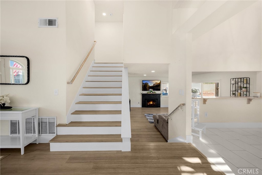 7077 Campbell Place Rancho Cucamonga, CA 91701 - Photo 25 of 74 a view of entryway and hall with wooden floor