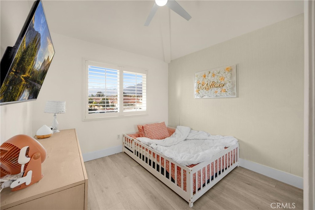 7077 Campbell Place Rancho Cucamonga, CA 91701 - Photo 30 of 74 a bedroom with a bed and a window